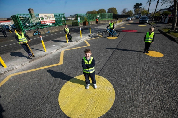 Photo of colourful circular road markings at Scoil Fhursa. Cromcastle